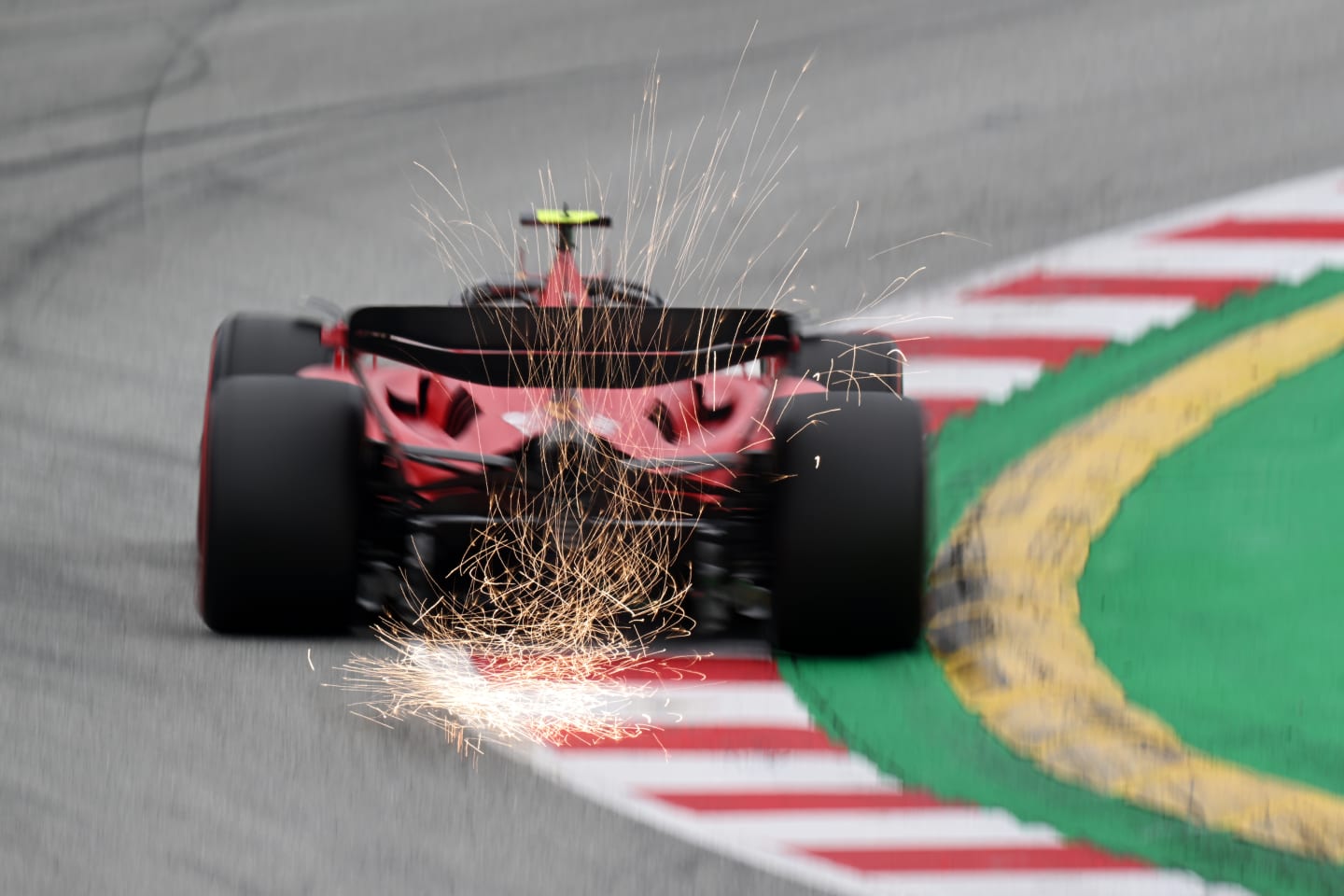 BARCELONA, SPAIN - JUNE 03: Sparks fly behind Carlos Sainz of Spain driving (55) the Ferrari SF-23 on track during qualifying ahead of the F1 Grand Prix of Spain at Circuit de Barcelona-Catalunya on June 03, 2023 in Barcelona, Spain. (Photo by David Ramos/Getty Images)