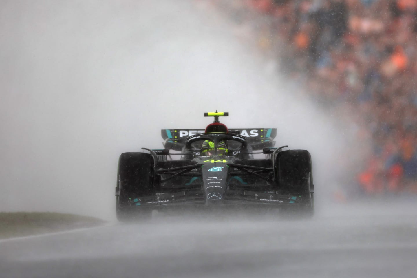ZANDVOORT, NETHERLANDS - AUGUST 27: Lewis Hamilton of Great Britain driving the (44) Mercedes AMG Petronas F1 Team W14 in the rain during the F1 Grand Prix of The Netherlands at Circuit Zandvoort on August 27, 2023 in Zandvoort, Netherlands. (Photo by Lars Baron/Getty Images)