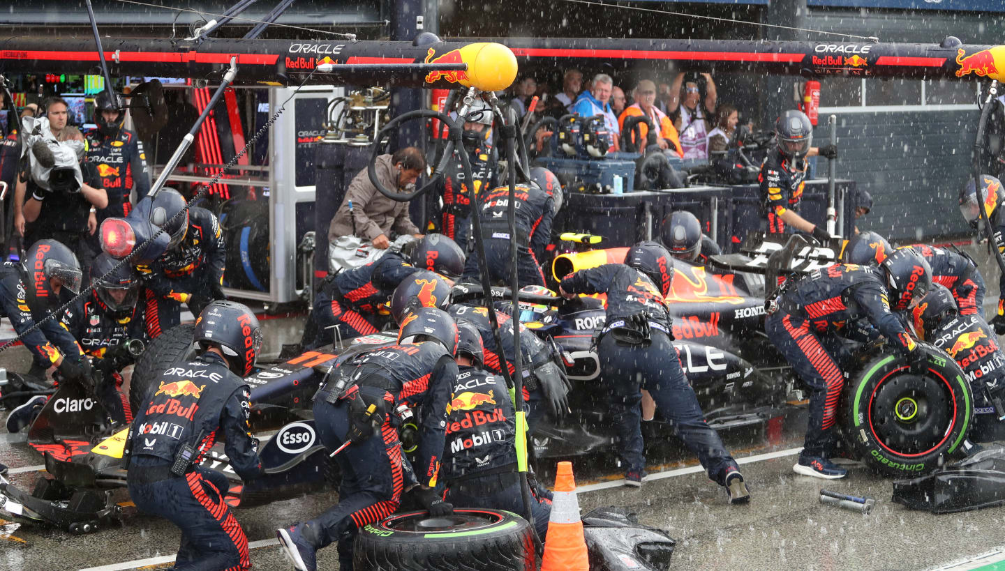 ZANDVOORT, NETHERLANDS - AUGUST 27: Sergio Perez of Mexico driving the (11) Oracle Red Bull Racing RB19 makes a pitstop in the rain during the F1 Grand Prix of The Netherlands at Circuit Zandvoort on August 27, 2023 in Zandvoort, Netherlands. (Photo by Peter Fox/Getty Images)
