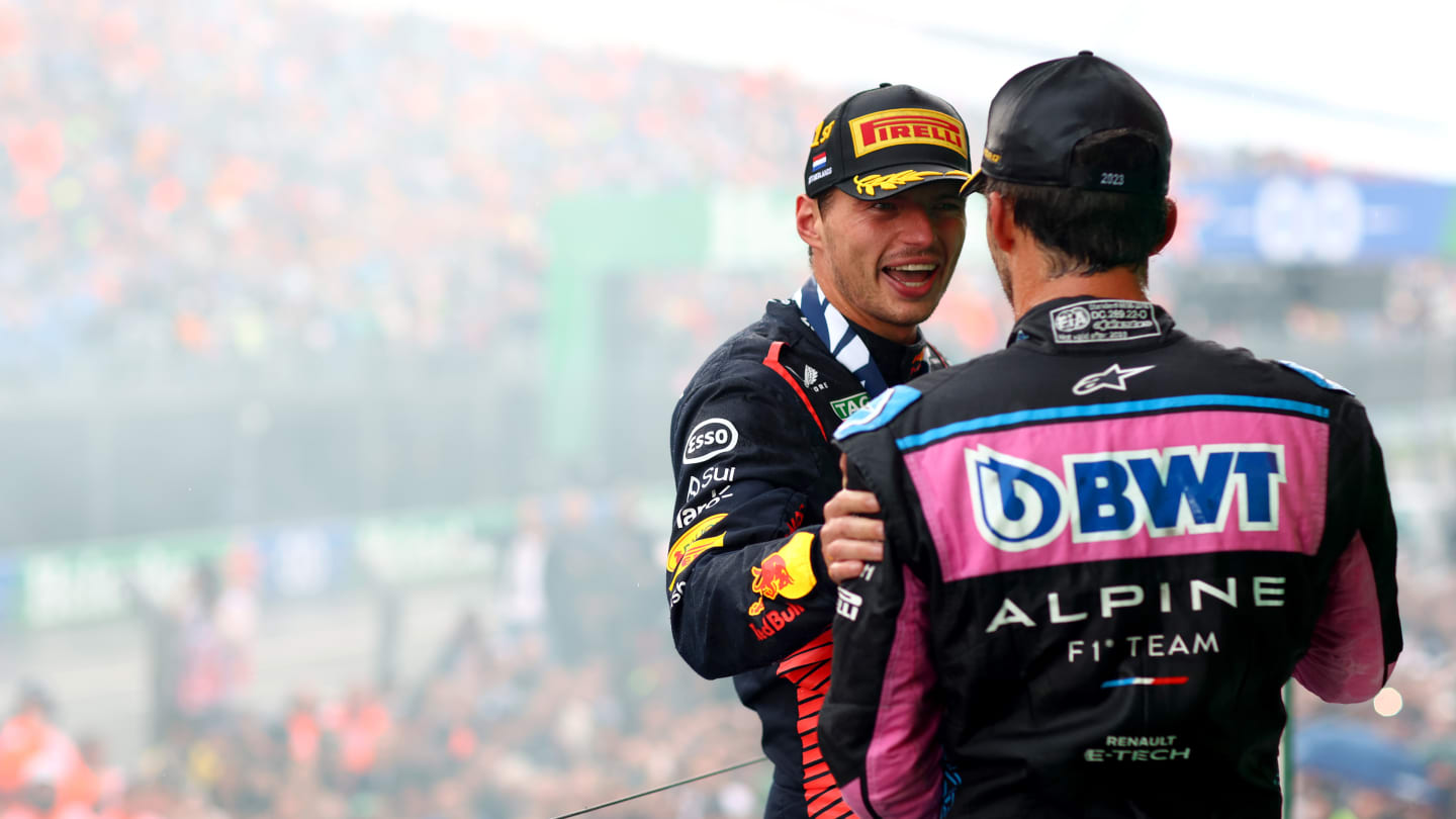 ZANDVOORT, NETHERLANDS - AUGUST 27: Race winner Max Verstappen of the Netherlands and Oracle Red Bull Racing and Third placed Pierre Gasly of France and Alpine F1 celebrate on the podium during the F1 Grand Prix of The Netherlands at Circuit Zandvoort on August 27, 2023 in Zandvoort, Netherlands. (Photo by Dan Istitene - Formula 1/Formula 1 via Getty Images)
