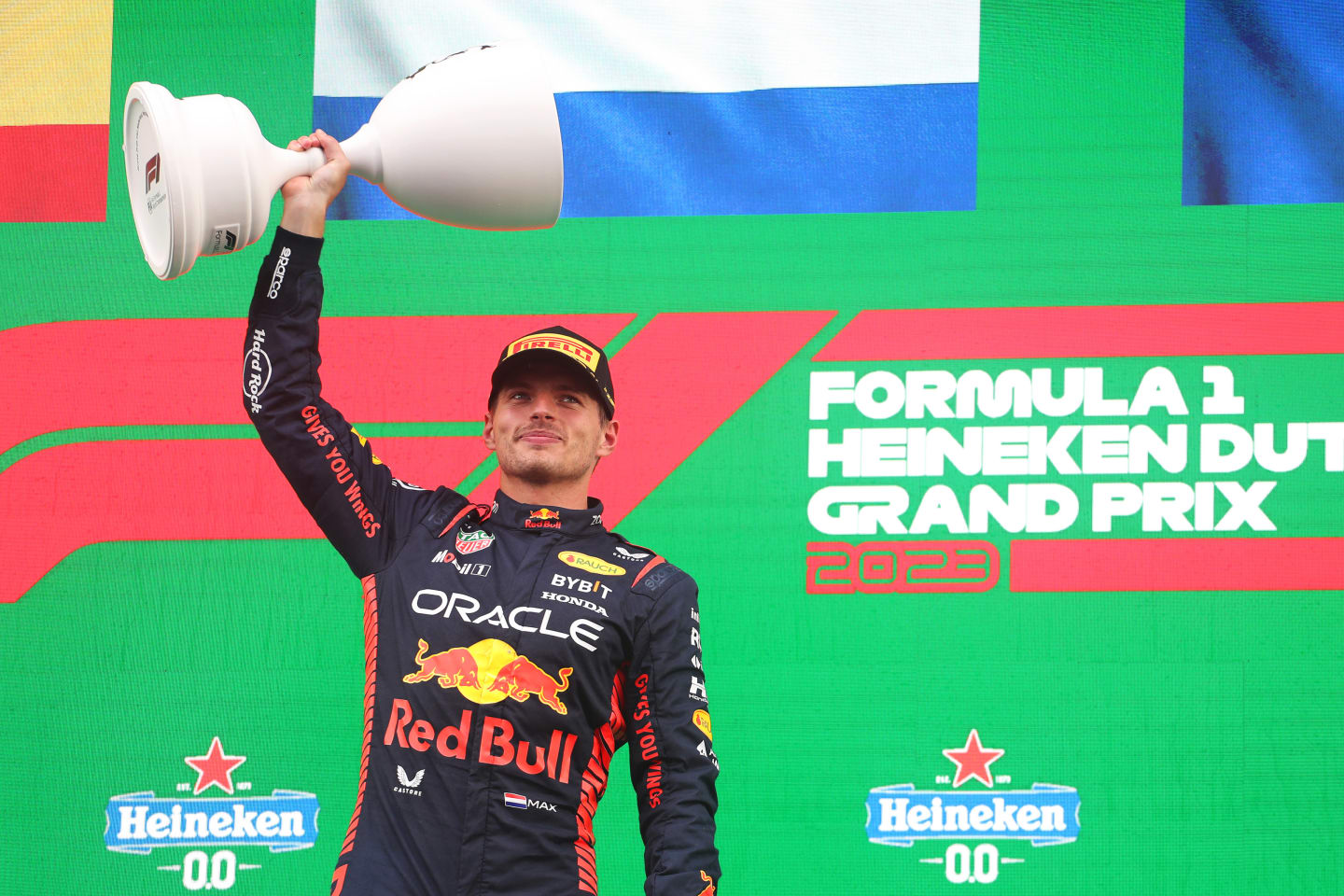 ZANDVOORT, NETHERLANDS - AUGUST 27: Race winner Max Verstappen of the Netherlands and Oracle Red Bull Racing celebrates on the podium during the F1 Grand Prix of The Netherlands at Circuit Zandvoort on August 27, 2023 in Zandvoort, Netherlands. (Photo by Peter Fox/Getty Images)