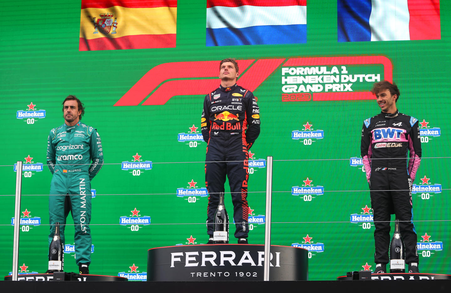 ZANDVOORT, NETHERLANDS - AUGUST 27: Race winner Max Verstappen of the Netherlands and Oracle Red Bull Racing, Second placed Fernando Alonso of Spain and Aston Martin F1 Team, Third placed Pierre Gasly of France and Alpine F1 and Edward Aveling, Chief Designer at Red Bull Racing celebrate on the podium during the F1 Grand Prix of The Netherlands at Circuit Zandvoort on August 27, 2023 in Zandvoort, Netherlands. (Photo by Peter Fox/Getty Images)