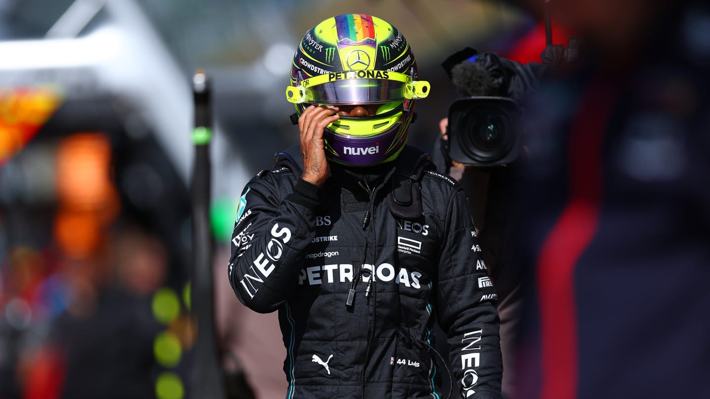 ZANDVOORT, NETHERLANDS - AUGUST 26: 13th placed qualifier Lewis Hamilton of Great Britain and Mercedes walks in the Pitlane during qualifying ahead of the F1 Grand Prix of The Netherlands at Circuit Zandvoort on August 26, 2023 in Zandvoort, Netherlands. (Photo by Dan Istitene - Formula 1/Formula 1 via Getty Images)