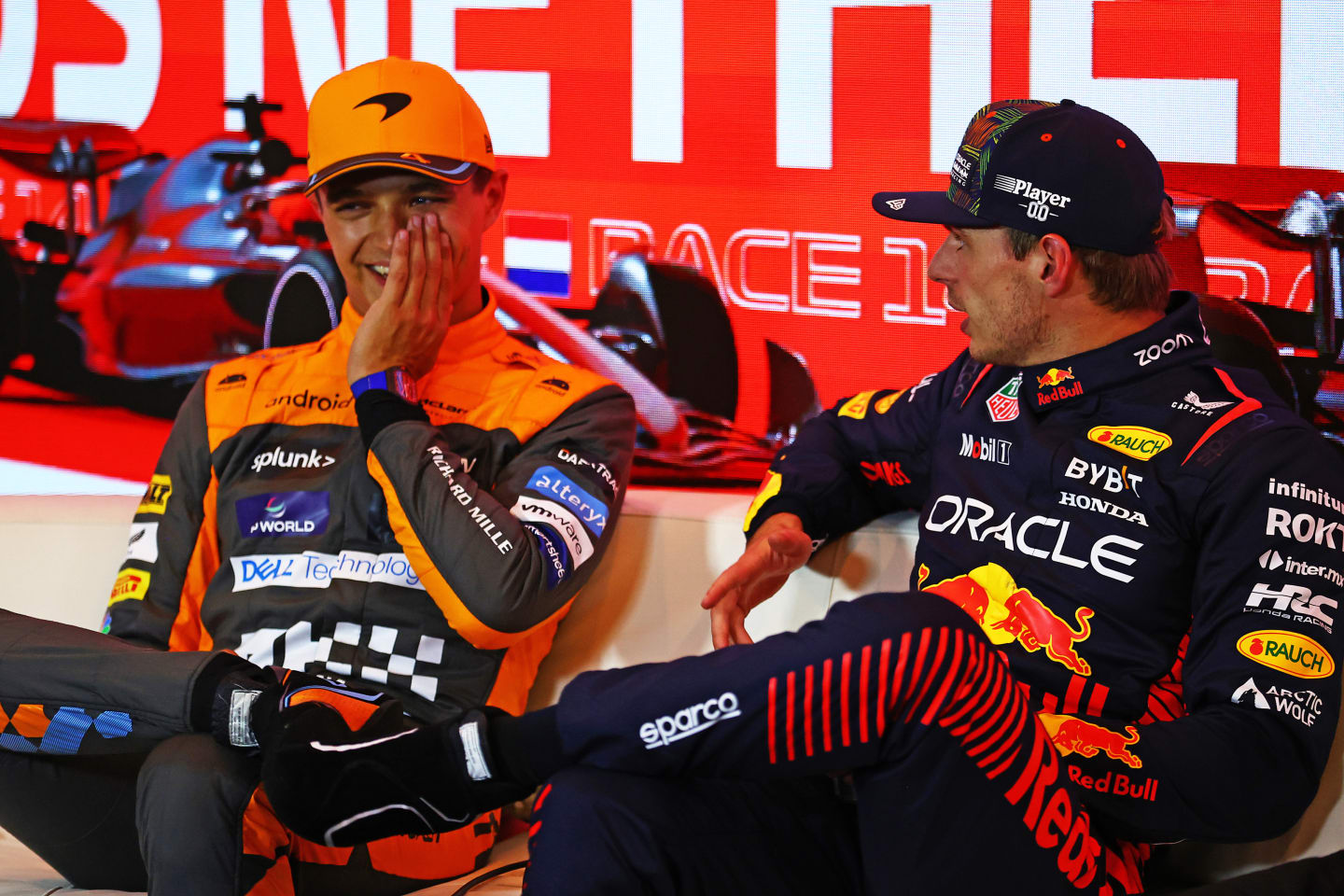 ZANDVOORT, NETHERLANDS - AUGUST 26: Pole position qualifier Max Verstappen of the Netherlands and Oracle Red Bull Racing (R), Second placed qualifier Lando Norris of Great Britain and McLaren (L) and attend the press conference after qualifying ahead of the F1 Grand Prix of The Netherlands at Circuit Zandvoort on August 26, 2023 in Zandvoort, Netherlands. (Photo by Bryn Lennon/Getty Images)