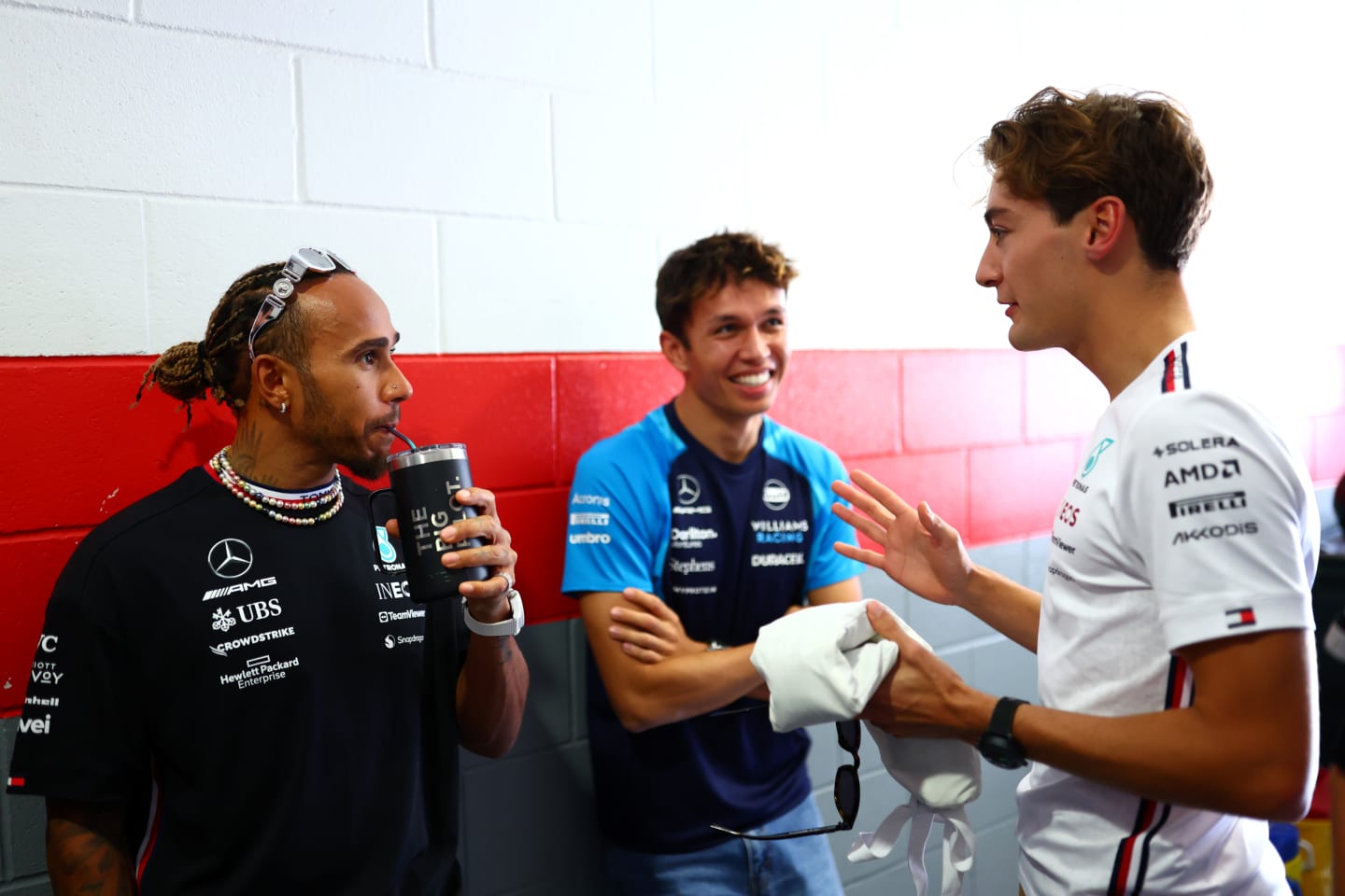 AUSTIN, TEXAS - OCTOBER 22: Lewis Hamilton of Great Britain and Mercedes speaks to George Russell of Great Britain and Mercedes and Alexander Albon of Thailand and Williams in the Pitlane prior to the F1 Grand Prix of United States at Circuit of The Americas on October 22, 2023 in Austin, Texas. (Photo by Dan Istitene - Formula 1/Formula 1 via Getty Images)