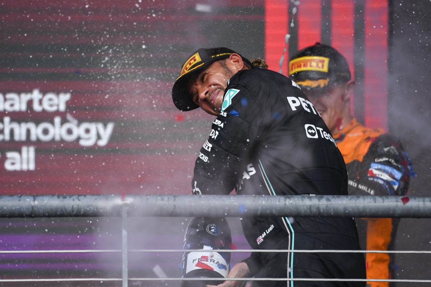 AUSTIN, TEXAS - OCTOBER 22: Second placed Lewis Hamilton of Great Britain and Mercedes celebrates on the podium during the F1 Grand Prix of United States at Circuit of The Americas on October 22, 2023 in Austin, Texas. (Photo by Rudy Carezzevoli/Getty Images)