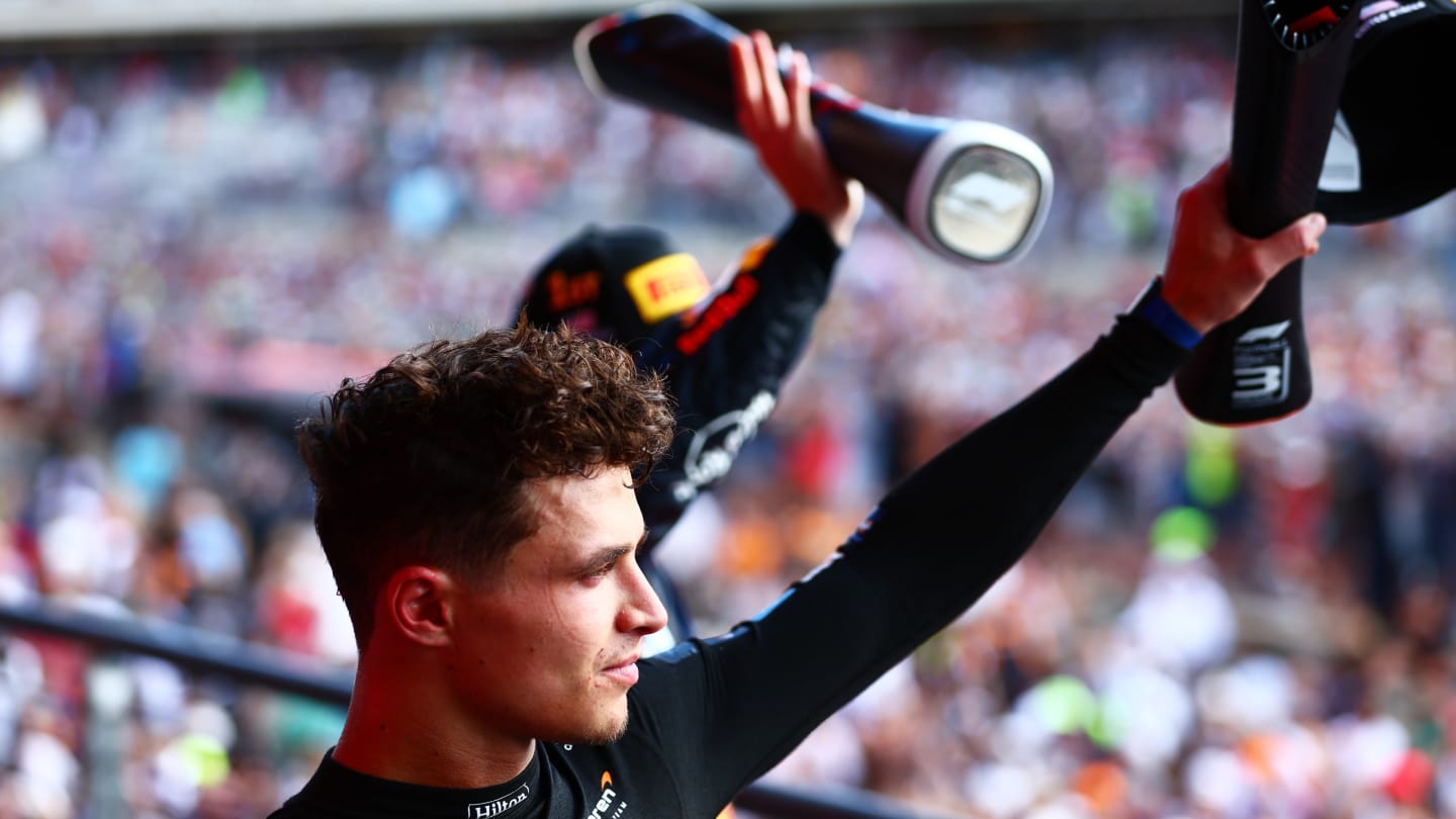 AUSTIN, TEXAS - OCTOBER 22: Third placed Lando Norris of Great Britain and McLaren celebrates on the podium during the F1 Grand Prix of United States at Circuit of The Americas on October 22, 2023 in Austin, Texas. (Photo by Dan Istitene - Formula 1/Formula 1 via Getty Images)