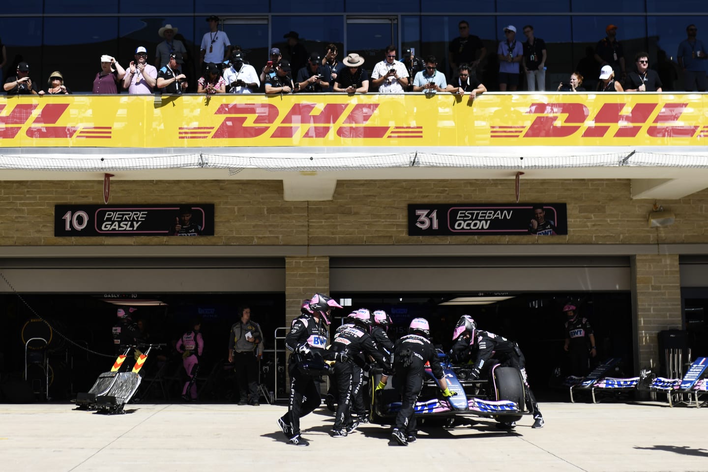 AUSTIN, TEXAS - OCTOBER 22: Esteban Ocon of France and Alpine F1 is pushed into the garage during