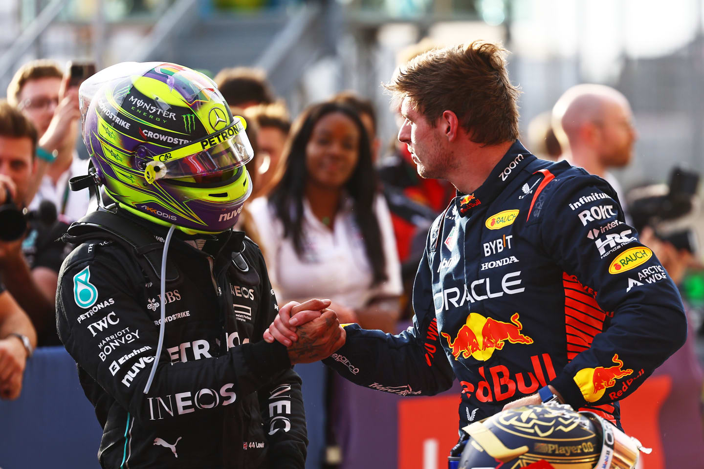 AUSTIN, TEXAS - OCTOBER 21: Sprint winner Max Verstappen of the Netherlands and Oracle Red Bull Racing shakes hands with Second placed Lewis Hamilton of Great Britain and Mercedes in parc ferme after the Sprint ahead of the F1 Grand Prix of United States at Circuit of The Americas on October 21, 2023 in Austin, Texas. (Photo by Mark Thompson/Getty Images)