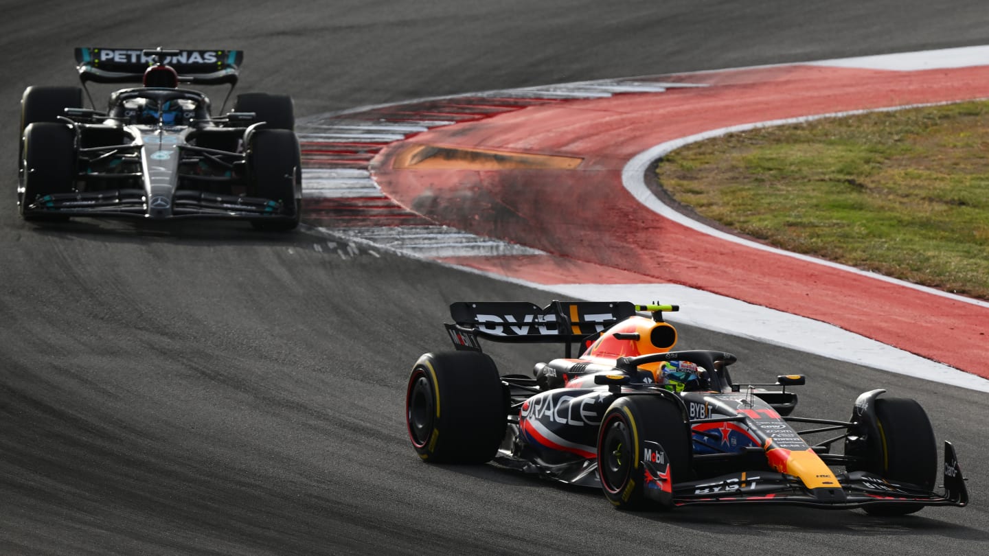 AUSTIN, TEXAS - OCTOBER 21: Sergio Perez of Mexico driving the (11) Oracle Red Bull Racing RB19 leads George Russell of Great Britain driving the (63) Mercedes AMG Petronas F1 Team W14 during the Sprint ahead of the F1 Grand Prix of United States at Circuit of The Americas on October 21, 2023 in Austin, Texas. (Photo by Clive Mason - Formula 1/Formula 1 via Getty Images)