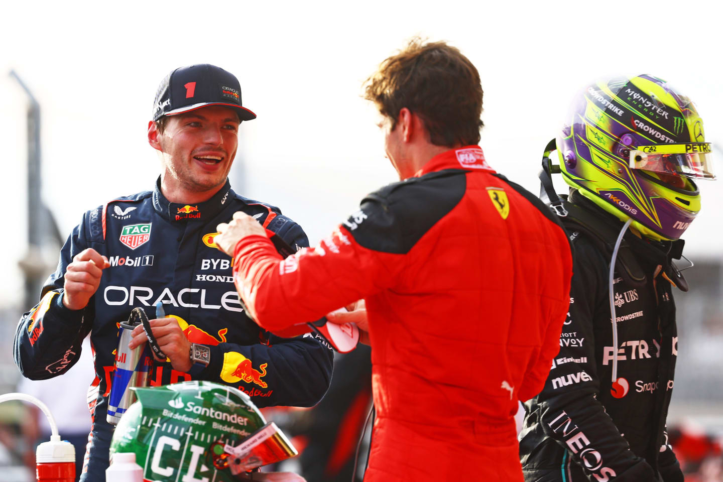 AUSTIN, TEXAS - OCTOBER 21: Sprint winner Max Verstappen of the Netherlands and Oracle Red Bull Racing and Third placed Charles Leclerc of Monaco and Ferrari talk in parc ferme during the Sprint ahead of the F1 Grand Prix of United States at Circuit of The Americas on October 21, 2023 in Austin, Texas. (Photo by Mark Thompson/Getty Images)