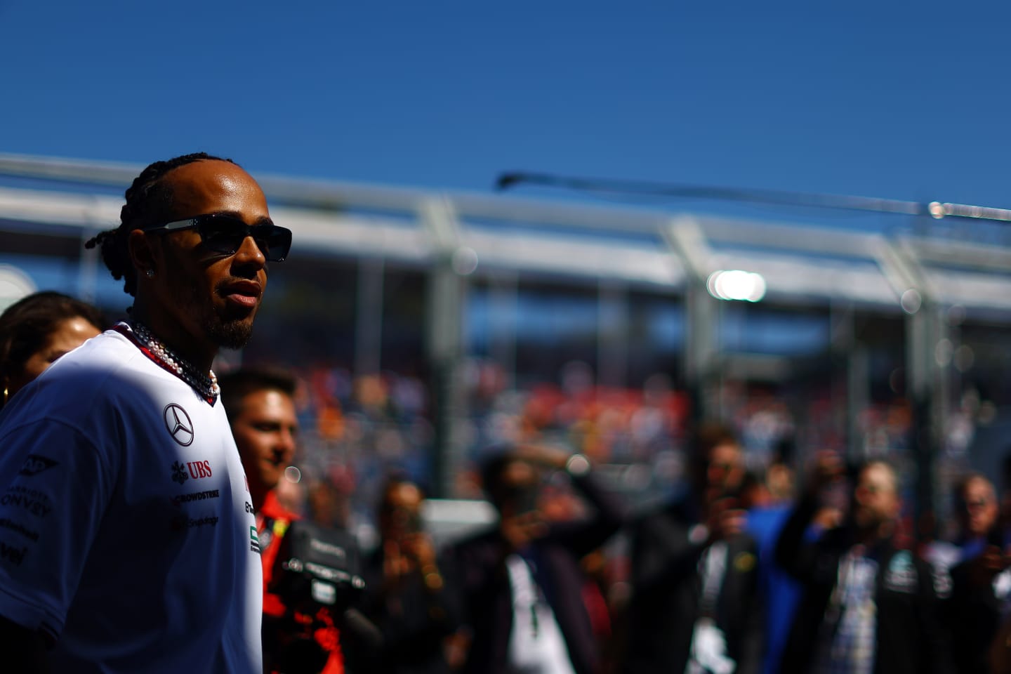 MELBOURNE, AUSTRALIA - MARCH 24: Lewis Hamilton of Great Britain and Mercedes looks on from the drivers parade prior to the F1 Grand Prix of Australia at Albert Park Circuit on March 24, 2024 in Melbourne, Australia. (Photo by Mark Thompson/Getty Images)