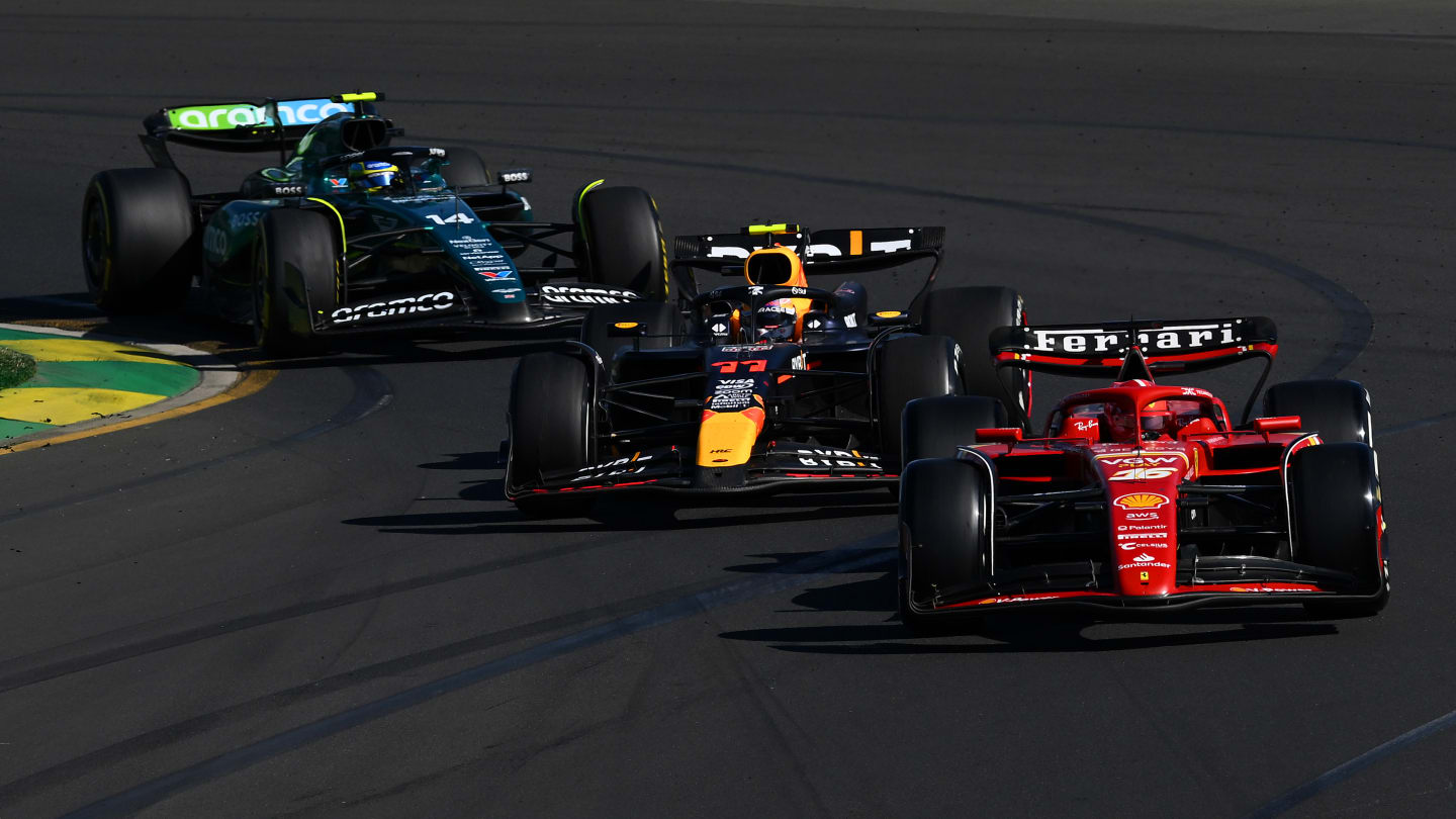 MELBOURNE, AUSTRALIA - MARCH 24: Charles Leclerc of Monaco driving the (16) Ferrari SF-24 leads Sergio Perez of Mexico driving the (11) Oracle Red Bull Racing RB20 and Fernando Alonso of Spain driving the (14) Aston Martin AMR24 Mercedes during the F1 Grand Prix of Australia at Albert Park Circuit on March 24, 2024 in Melbourne, Australia. (Photo by Clive Mason - Formula 1/Formula 1 via Getty Images)
