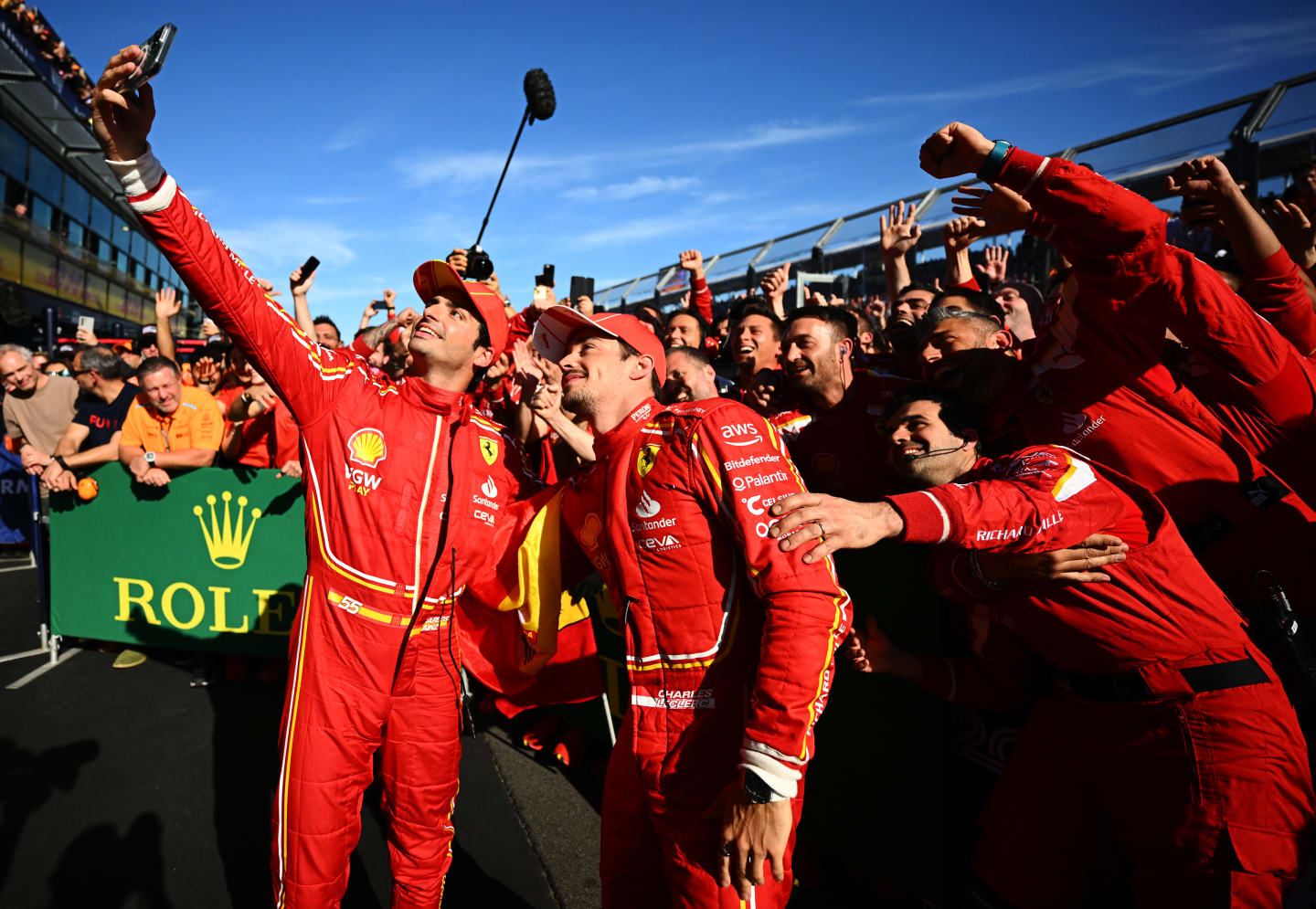 MELBOURNE, AUSTRALIA - MARCH 24: Race winner Carlos Sainz of Spain and Ferrari and Second placed Charles Leclerc of Monaco and Ferrari celebrate with their team in parc ferme during the F1 Grand Prix of Australia at Albert Park Circuit on March 24, 2024 in Melbourne, Australia. (Photo by Clive Mason - Formula 1/Formula 1 via Getty Images)