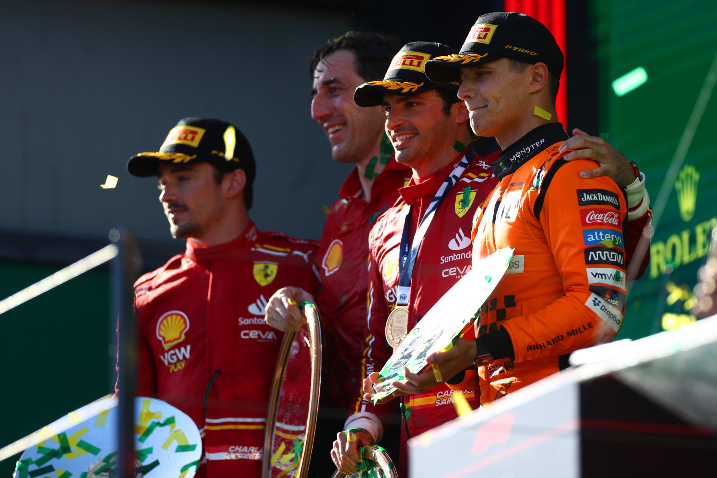 MELBOURNE, AUSTRALIA - MARCH 24: Race winner Carlos Sainz of Spain and Ferrari, Second placed Charles Leclerc of Monaco and Ferrari and Third placed Lando Norris of Great Britain and McLaren celebrate on the podium duringthe F1 Grand Prix of Australia at Albert Park Circuit on March 24, 2024 in Melbourne, Australia. (Photo by Peter Fox/Getty Images)