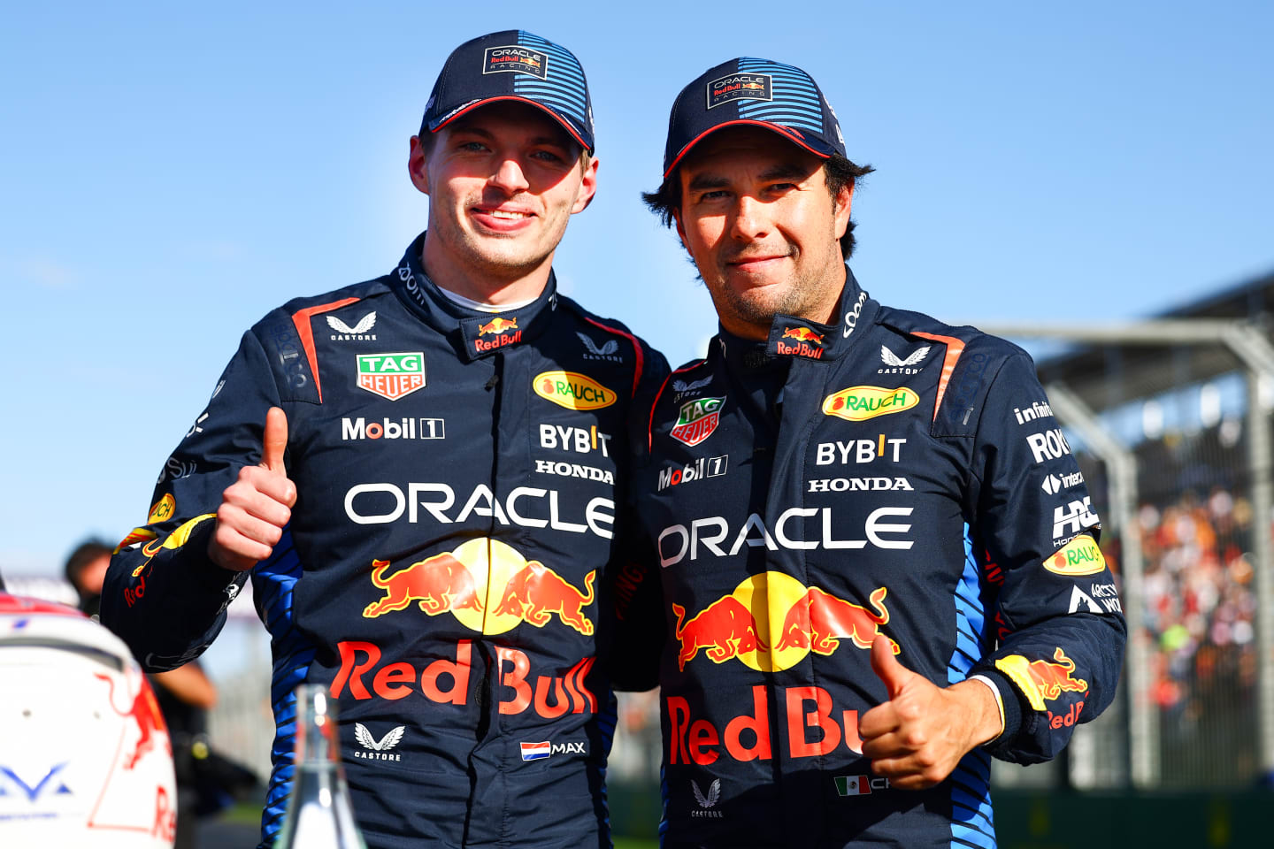 MELBOURNE, AUSTRALIA - MARCH 23: Pole position qualifier Max Verstappen of the Netherlands and Oracle Red Bull Racing and Third placed qualifier Sergio Perez of Mexico and Oracle Red Bull Racing celebrate in parc ferme during qualifying ahead of the F1 Grand Prix of Australia at Albert Park Circuit on March 23, 2024 in Melbourne, Australia. (Photo by Mark Thompson/Getty Images)