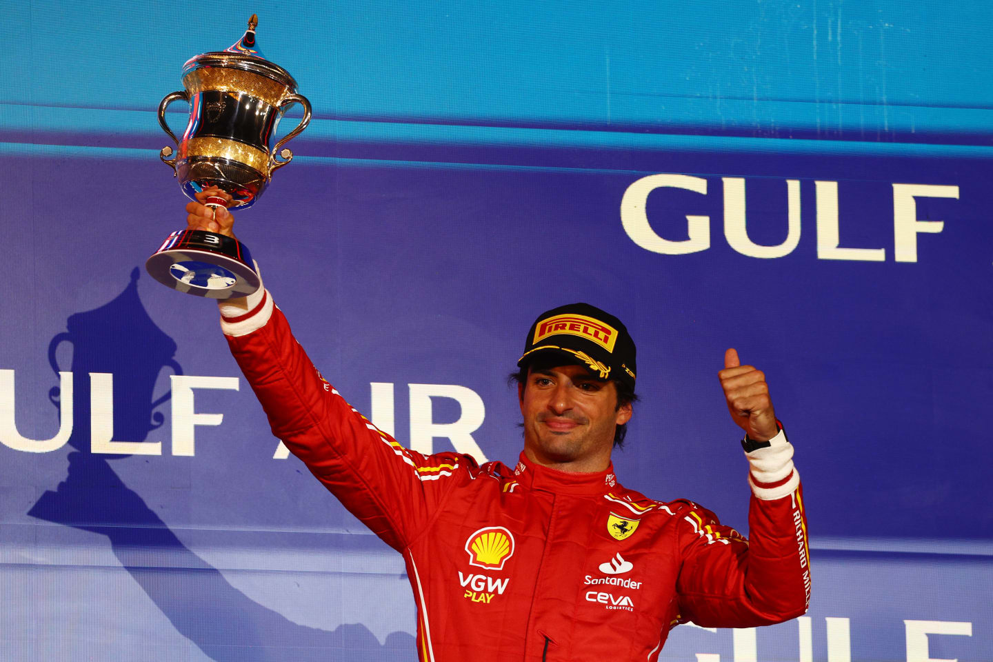BAHRAIN, BAHRAIN - MARCH 02: Third placed Carlos Sainz of Spain and Ferrari celebrates on the podium during the F1 Grand Prix of Bahrain at Bahrain International Circuit on March 02, 2024 in Bahrain, Bahrain. (Photo by Clive Rose/Getty Images)