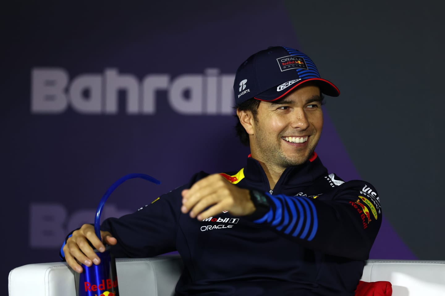 BAHRAIN, BAHRAIN - MARCH 02: Second placed Sergio Perez of Mexico and Oracle Red Bull Racing reacts in a press conference after the F1 Grand Prix of Bahrain at Bahrain International Circuit on March 02, 2024 in Bahrain, Bahrain. (Photo by Bryn Lennon/Getty Images)