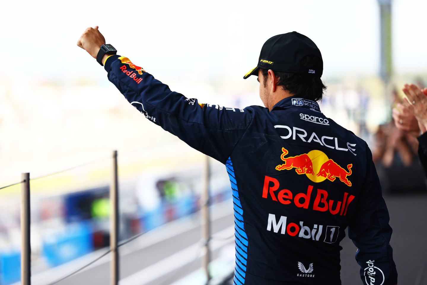 SUZUKA, JAPAN - APRIL 07: Second placed Sergio Perez of Mexico and Oracle Red Bull Racing celebrates on the podium during the F1 Grand Prix of Japan at Suzuka International Racing Course on April 07, 2024 in Suzuka, Japan. (Photo by Mark Thompson/Getty Images)