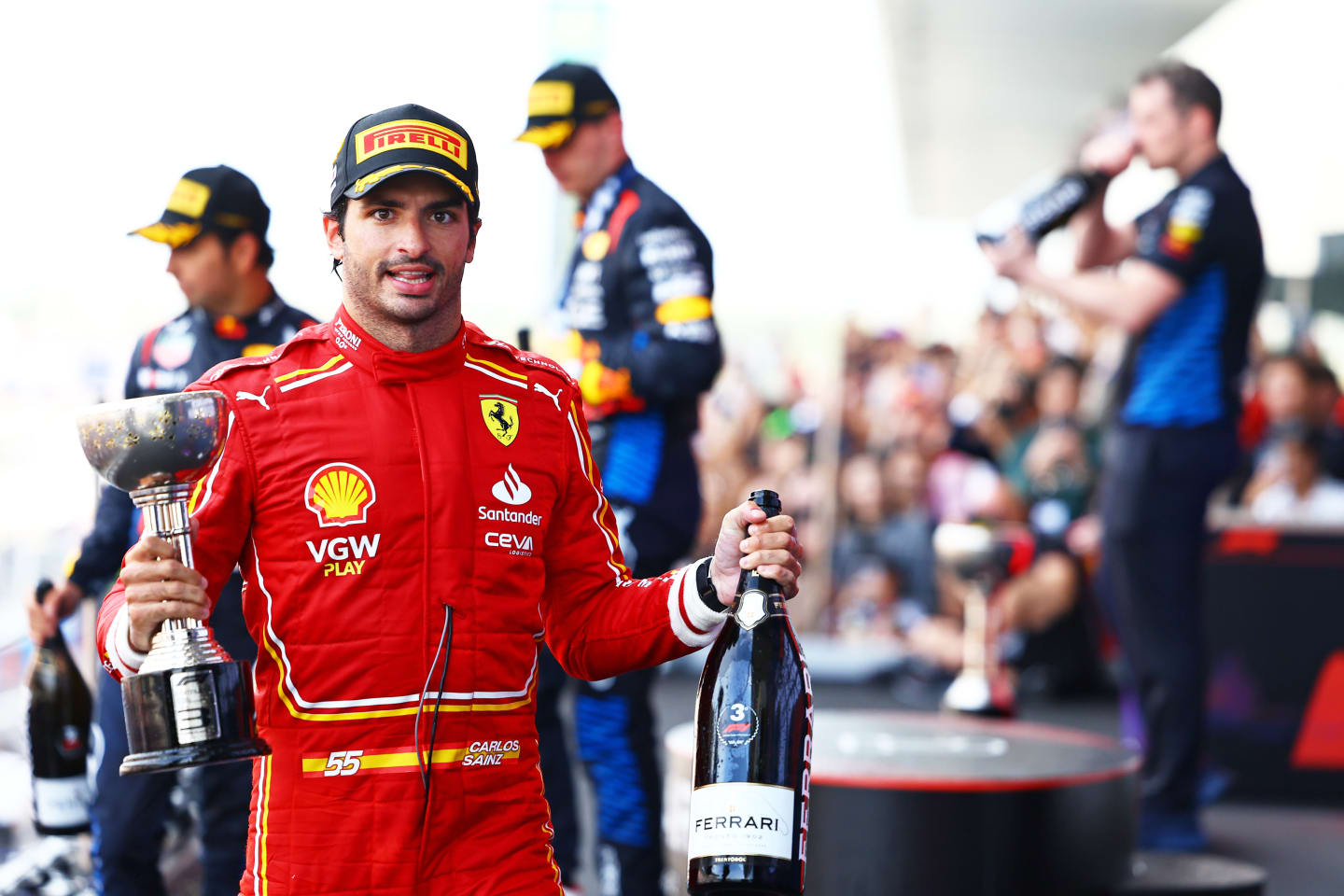 SUZUKA, JAPAN - APRIL 07: Third placed Carlos Sainz of Spain and Ferrari celebrates on the podium during the F1 Grand Prix of Japan at Suzuka International Racing Course on April 07, 2024 in Suzuka, Japan. (Photo by Mark Thompson/Getty Images)