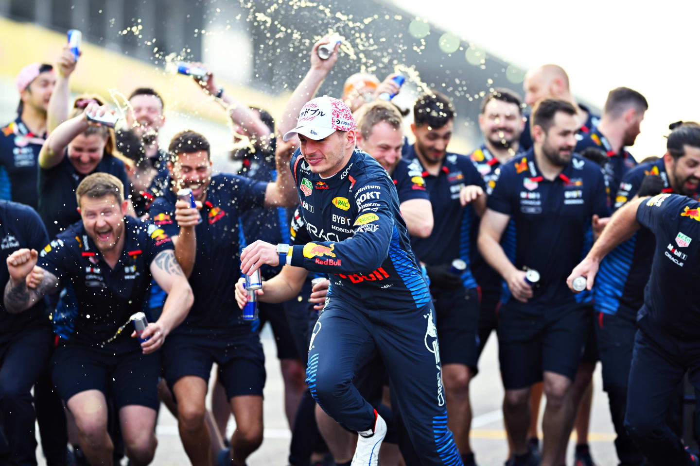 SUZUKA, JAPAN - APRIL 07: Race winner Max Verstappen of the Netherlands and Oracle Red Bull Racing celebrates with his team after the F1 Grand Prix of Japan at Suzuka International Racing Course on April 07, 2024 in Suzuka, Japan. (Photo by Clive Mason/Getty Images)