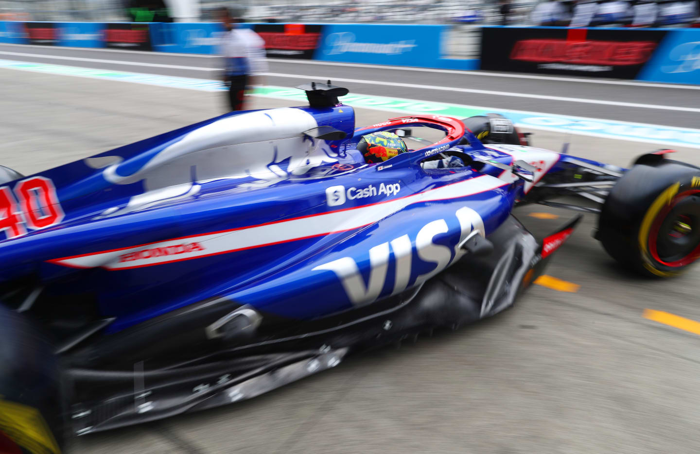 SUZUKA, JAPAN - APRIL 05: Ayumu Iwasa driving the (40) Visa Cash App RB VCARB 01 leaves the garage