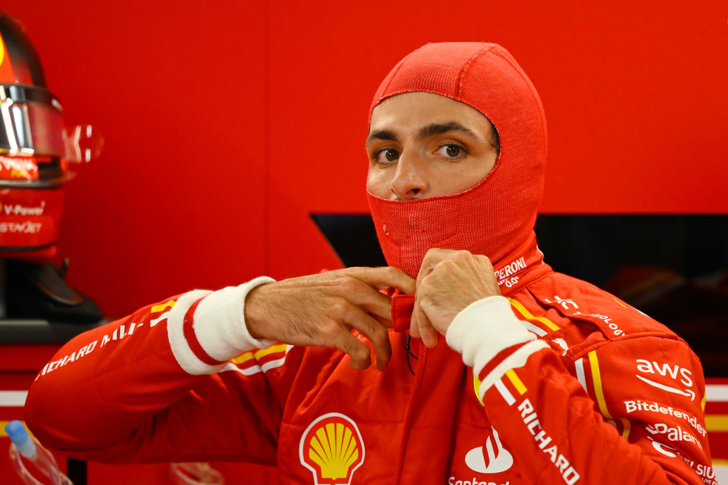 SUZUKA, JAPAN - APRIL 05: Carlos Sainz of Spain and Ferrari prepares to drive in the garage during practice ahead of the F1 Grand Prix of Japan at Suzuka International Racing Course on April 05, 2024 in Suzuka, Japan. (Photo by Clive Mason/Getty Images)