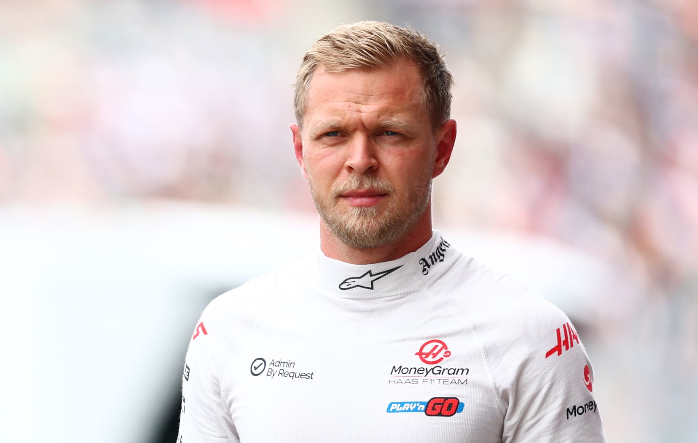 SUZUKA, JAPAN - APRIL 06: 18th placed qualifier Kevin Magnussen of Denmark and Haas F1 walks in the Pitlane during qualifying ahead of the F1 Grand Prix of Japan at Suzuka International Racing Course on April 06, 2024 in Suzuka, Japan. (Photo by Bryn Lennon - Formula 1/Formula 1 via Getty Images)