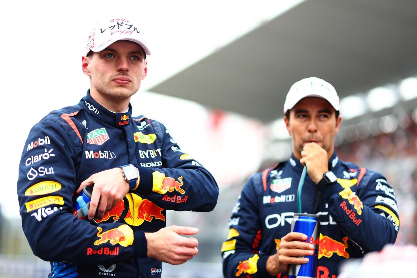 SUZUKA, JAPAN - APRIL 06: Pole position qualifier Max Verstappen of the Netherlands and Oracle Red Bull Racing and Second placed qualifier Sergio Perez of Mexico and Oracle Red Bull Racing look on in parc ferme during qualifying ahead of the F1 Grand Prix of Japan at Suzuka International Racing Course on April 06, 2024 in Suzuka, Japan. (Photo by Mark Thompson/Getty Images)