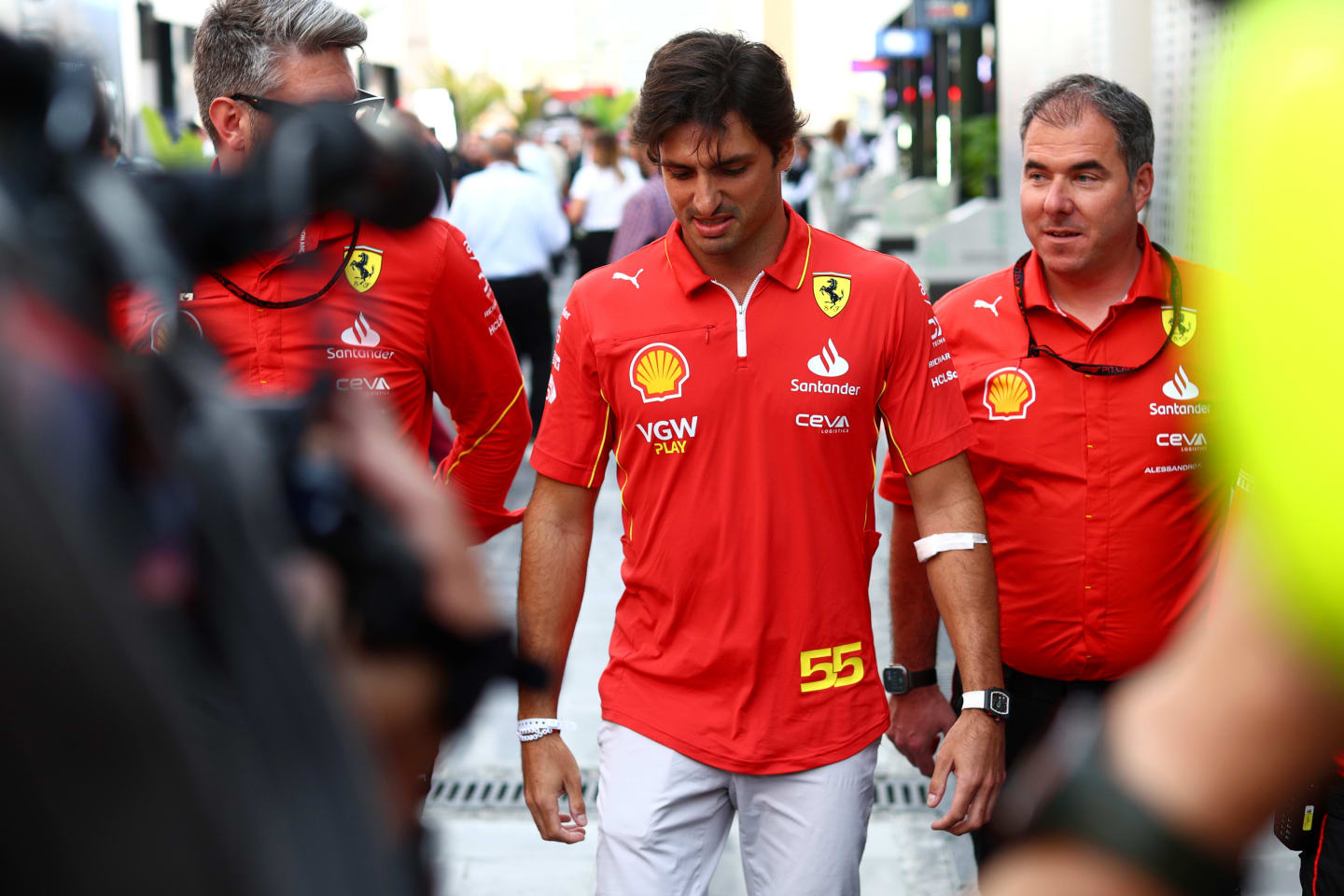 JEDDAH, SAUDI ARABIA - MARCH 09: Carlos Sainz of Spain and Ferrari walks in the Paddock after being