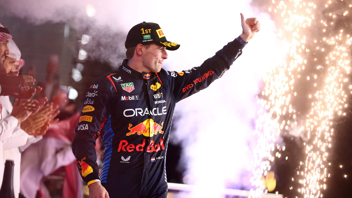 JEDDAH, SAUDI ARABIA - MARCH 09: Race winner Max Verstappen of the Netherlands and Oracle Red Bull Racing celebrates on the podium during the F1 Grand Prix of Saudi Arabia at Jeddah Corniche Circuit on March 09, 2024 in Jeddah, Saudi Arabia. (Photo by Bryn Lennon - Formula 1/Formula 1 via Getty Images)