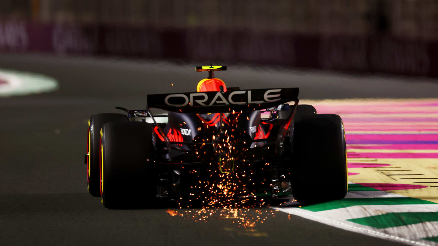 JEDDAH, SAUDI ARABIA - MARCH 07: Sparks fly from the car of Sergio Perez of Mexico driving the (11) Oracle Red Bull Racing RB20 during practice ahead of the F1 Grand Prix of Saudi Arabia at Jeddah Corniche Circuit on March 07, 2024 in Jeddah, Saudi Arabia. (Photo by Bryn Lennon - Formula 1/Formula 1 via Getty Images)