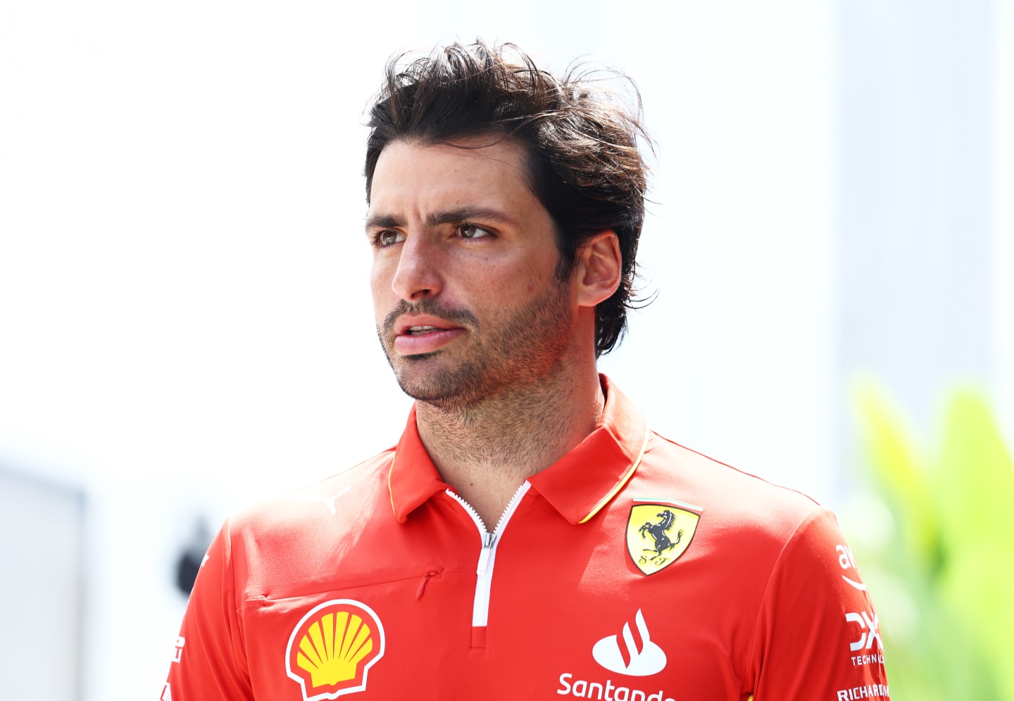 JEDDAH, SAUDI ARABIA - MARCH 06: Carlos Sainz of Spain and Ferrari walks in the Paddock during