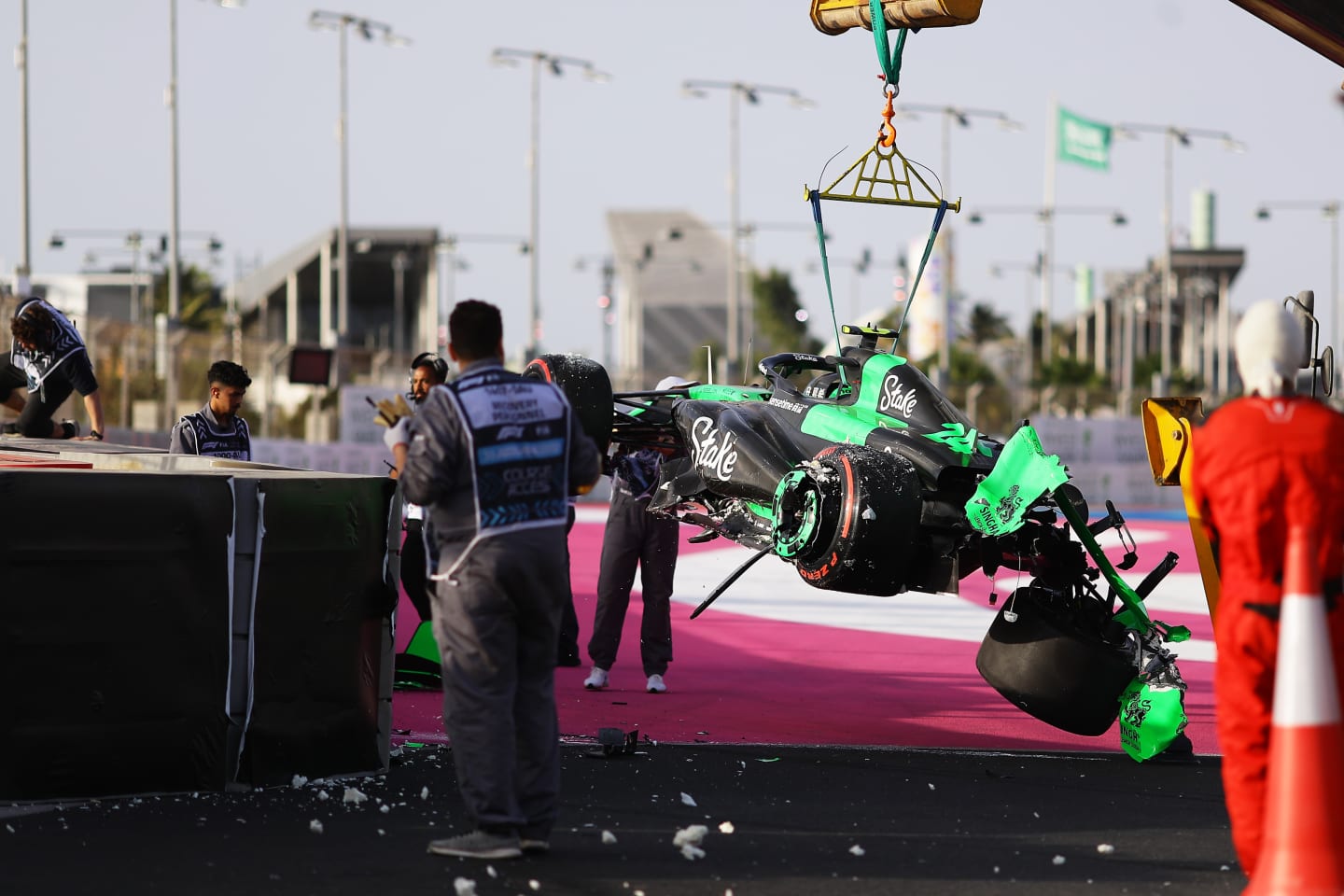 JEDDAH, SAUDI ARABIA - MARCH 08: The car of Zhou Guanyu of China and Stake F1 Team Kick Sauber is removed from the circuit after a crash causing a red flag during final practice ahead of the F1 Grand Prix of Saudi Arabia at Jeddah Corniche Circuit on March 08, 2024 in Jeddah, Saudi Arabia. (Photo by Joe Portlock - Formula 1/Formula 1 via Getty Images)