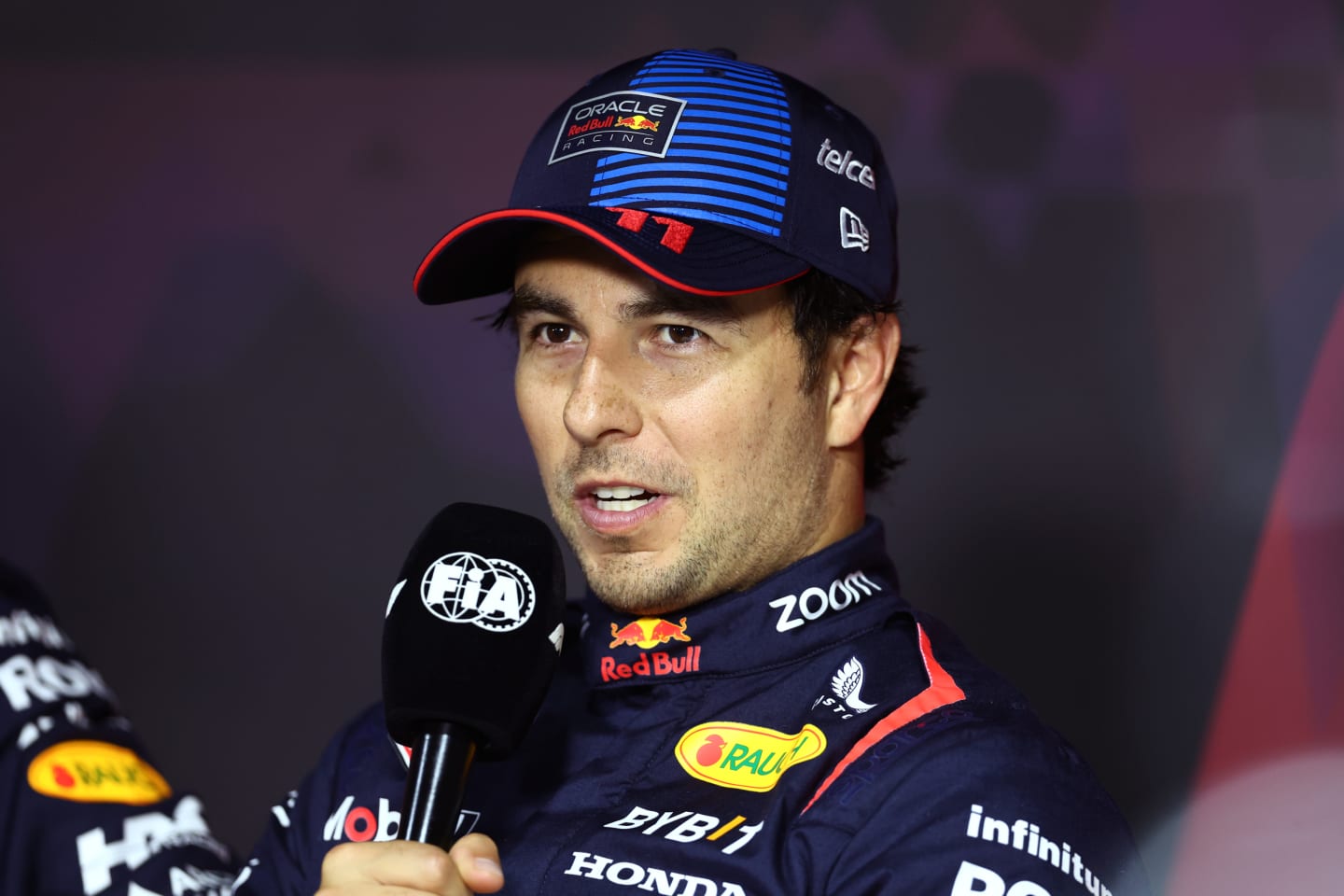 JEDDAH, SAUDI ARABIA - MARCH 08: Third placed qualifier Sergio Perez of Mexico and Oracle Red Bull Racing talks in a press conference after qualifying ahead of the F1 Grand Prix of Saudi Arabia at Jeddah Corniche Circuit on March 08, 2024 in Jeddah, Saudi Arabia. (Photo by Bryn Lennon/Getty Images)