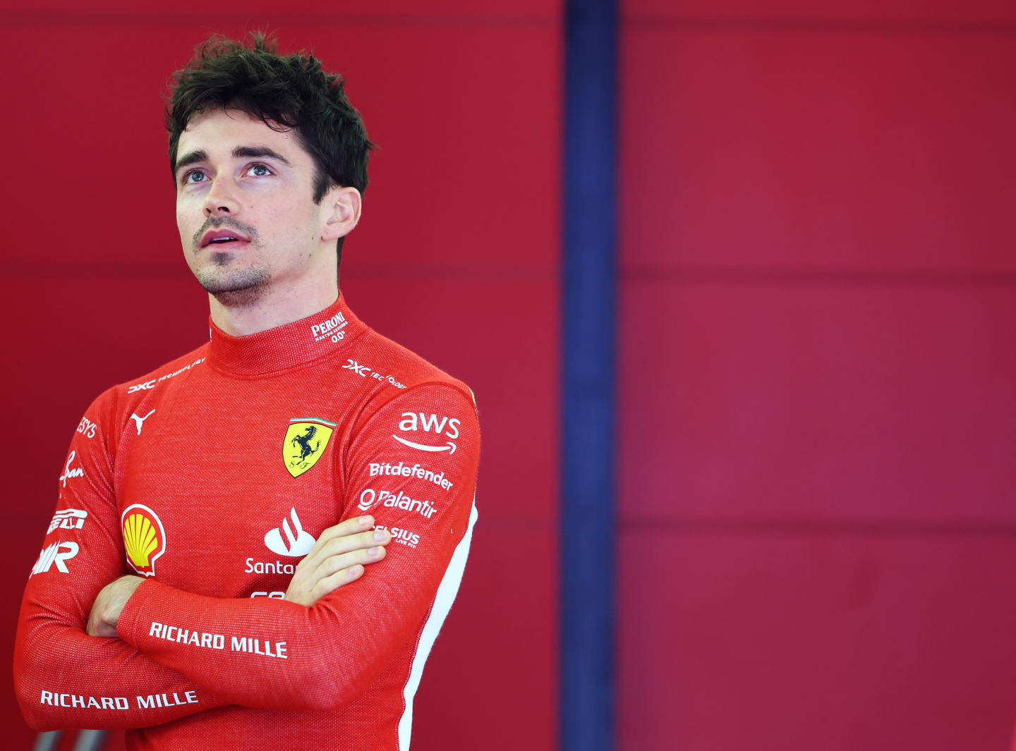 BAHRAIN, BAHRAIN - FEBRUARY 23: Charles Leclerc of Monaco and Ferrari looks on in the garage during