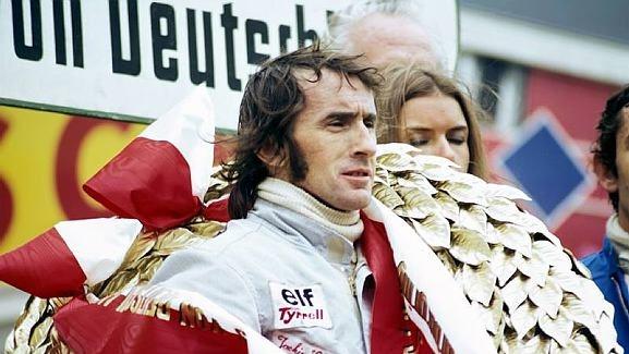 Jackie Stewart (GBR) Tyrrell celebrates his twenty-seventh and final GP victory on the podium. German Grand Prix, Nurburgring, 5 August 1973. © Sutton Images. No reproduction without permission