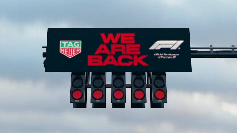 Formula 1 starting lights displaying red signals with TAG Heuer branding and the slogan 'We Are Back', symbolizing the excitement of F1 racing's return.