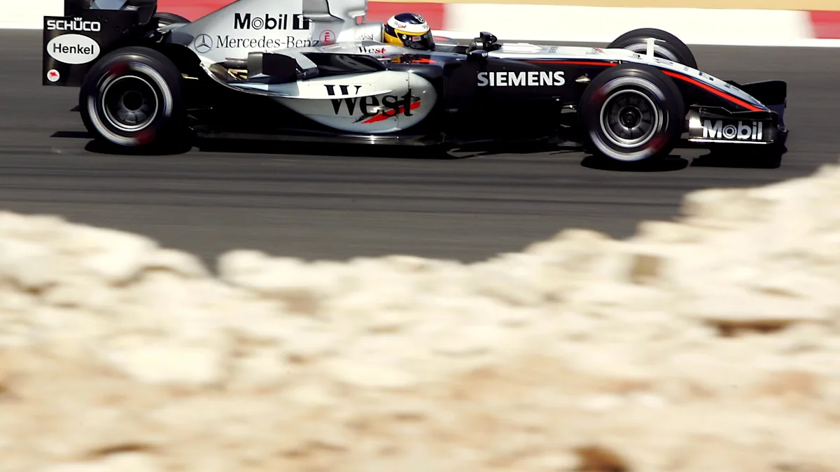 McLaren and Mercedes Formula 1 cars on track at Bahrain International Circuit