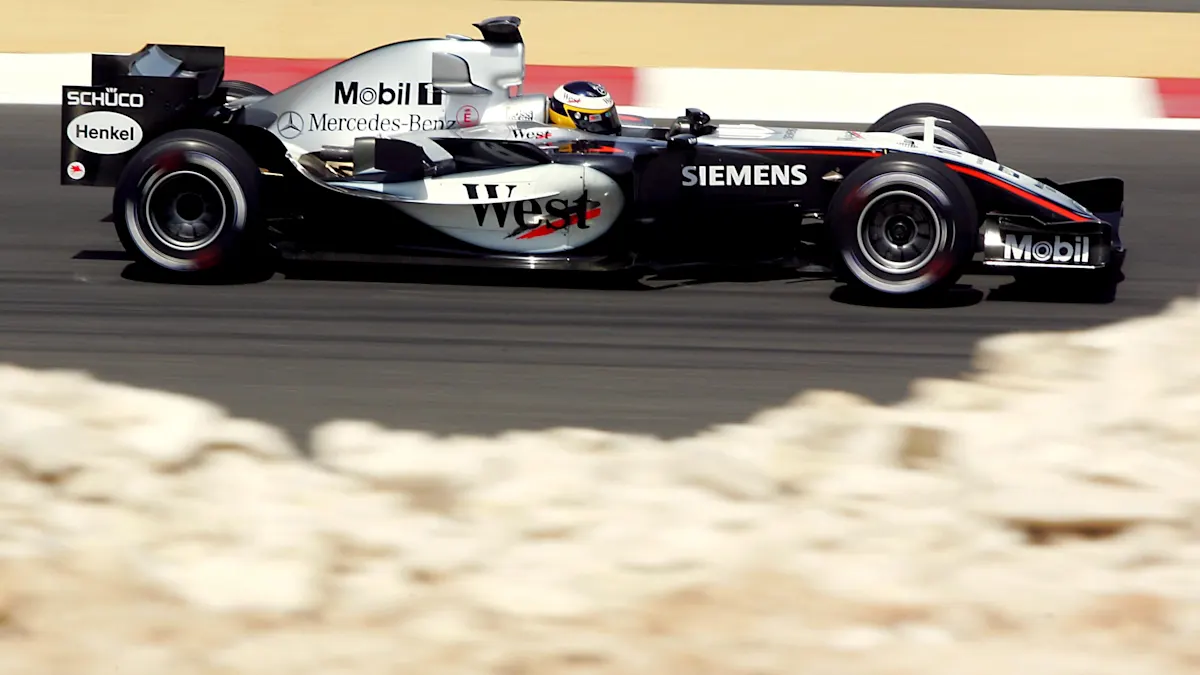 McLaren and Mercedes Formula 1 cars on track at Bahrain International Circuit