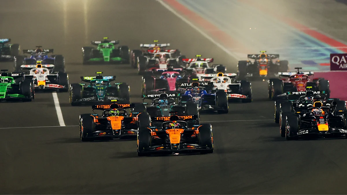 McLaren and Red Bull and Ferrari Formula 1 cars on track at Lusail International Circuit