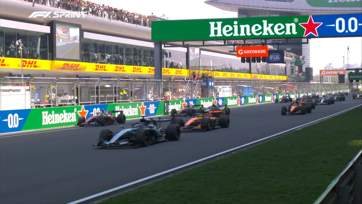 Ferrari and McLaren and Mercedes Formula 1 cars on track at Shanghai International Circuit