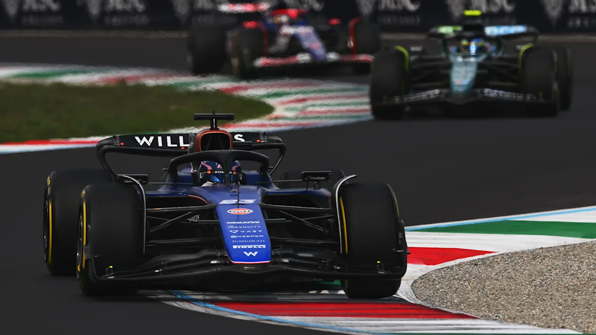 Aston Martin and Williams Formula 1 cars on track at Monza Circuit