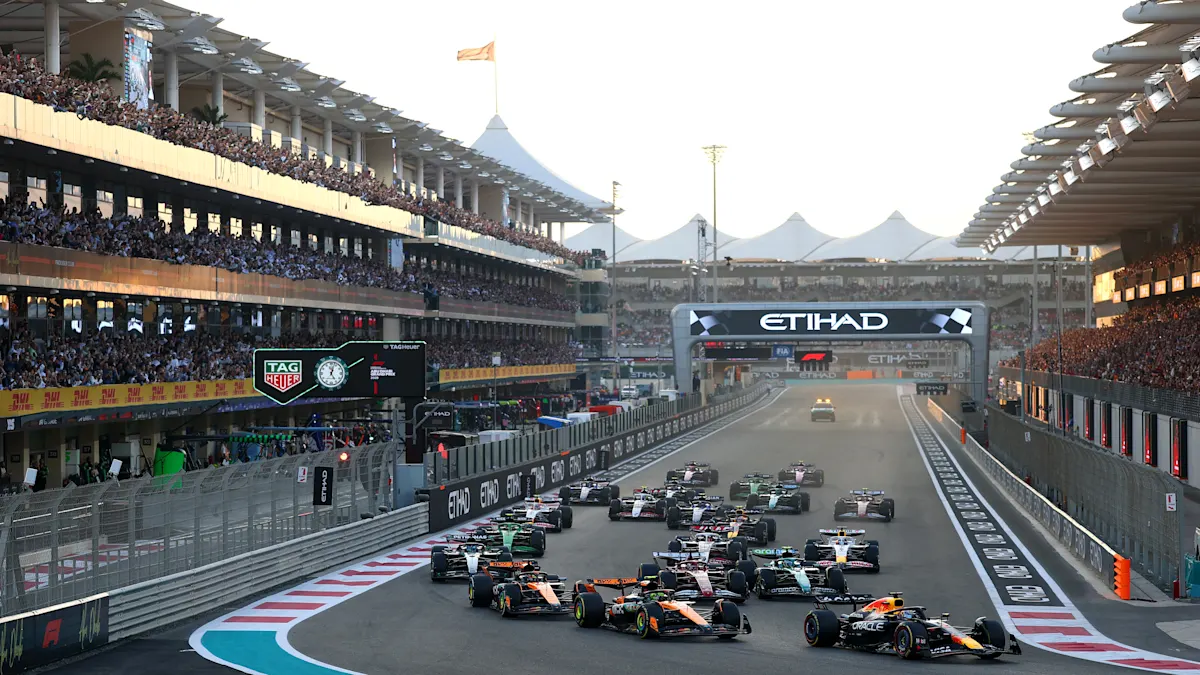 Red Bull and McLaren and Ferrari Formula 1 cars on track at Yas Marina Circuit
