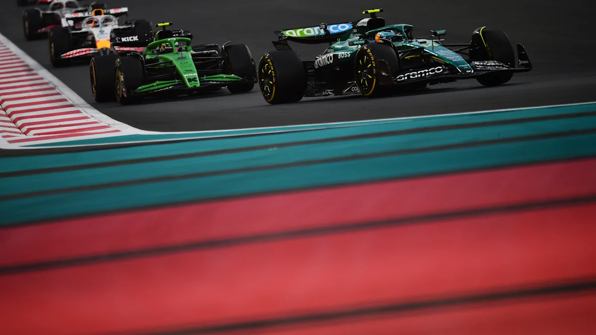 Aston Martin and Kick Sauber and VCARB Formula 1 cars on track at Yas Marina Circuit