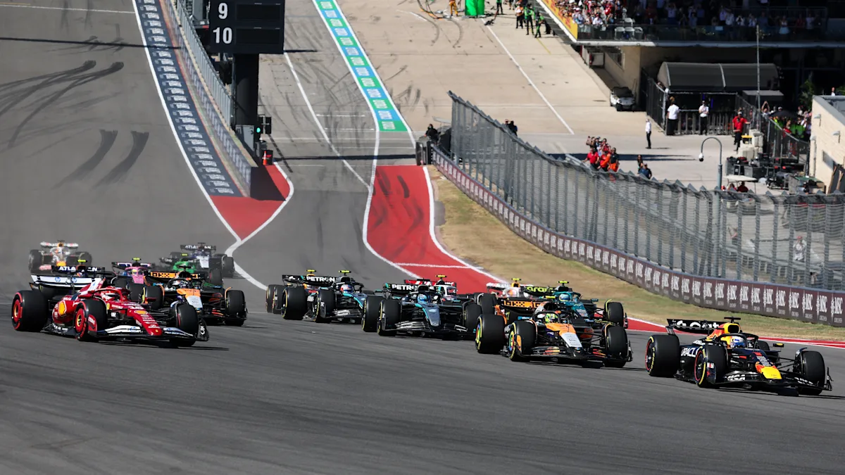 Red Bull and Ferrari and McLaren Formula 1 cars on track at Circuit of the Americas
