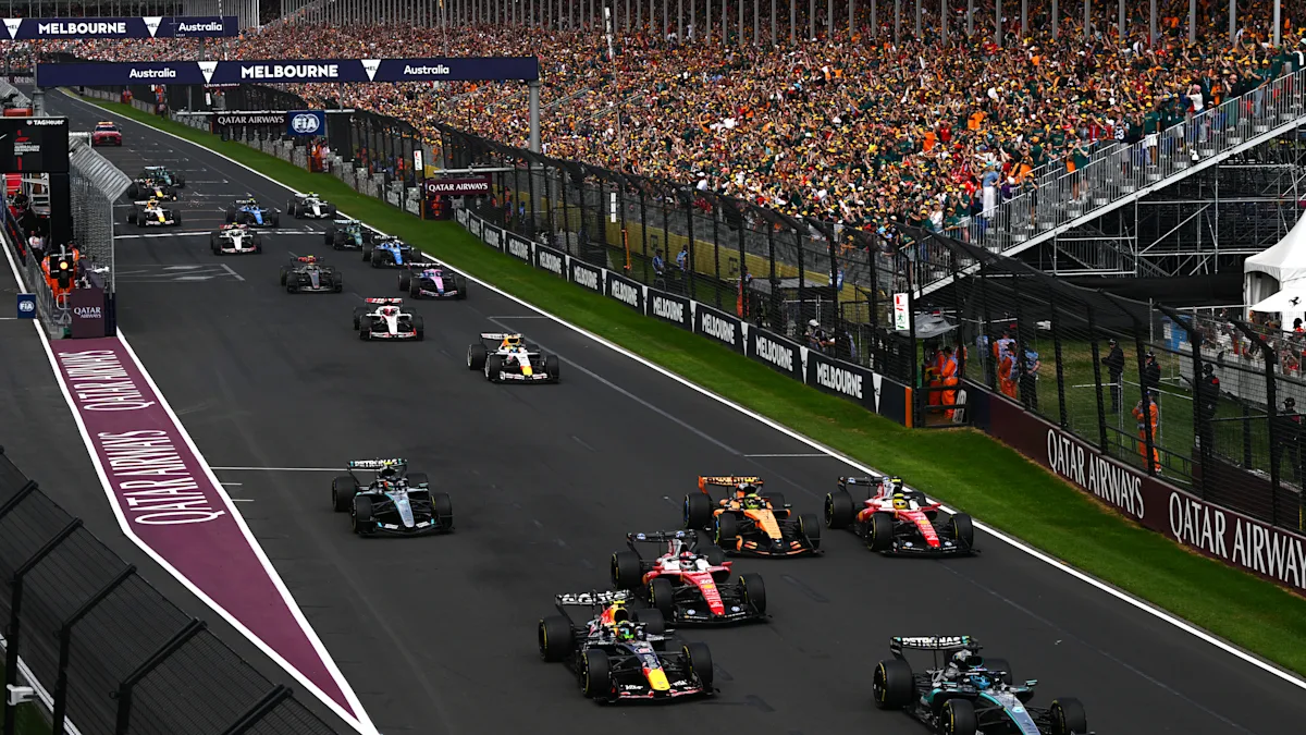 Ferrari and Mercedes and McLaren Formula 1 cars on track at Albert Park Circuit