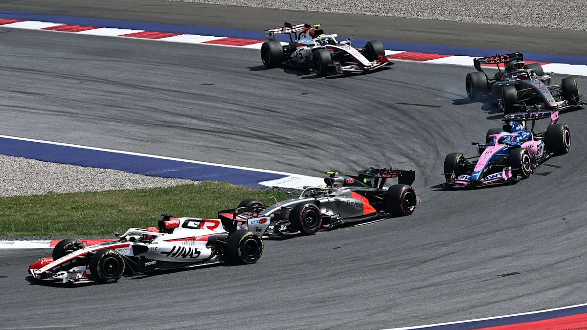Alpine and Audi and Haas Formula 1 cars on track at Red Bull Ring
