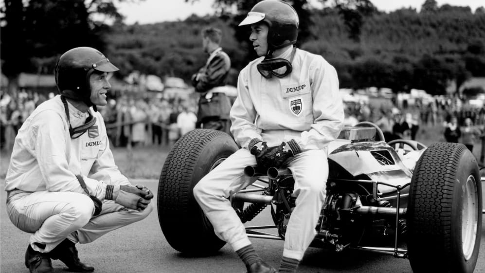 Spa-Francorchamps, Belgium. 12-14 June 1964.\rJim Clark (Lotus 25-Climax) talks to Dan Gurney