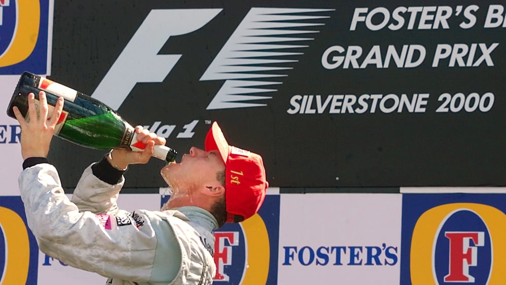 Coulthard celebrating his British Grand Prix win in 2000